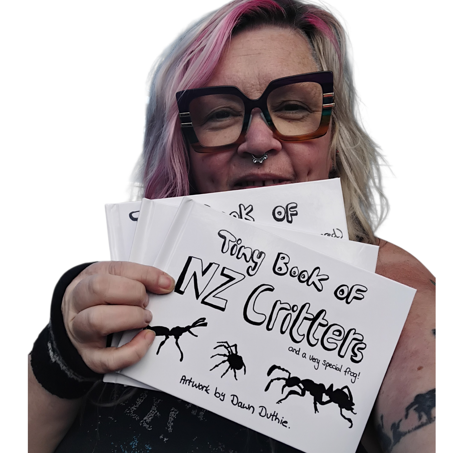 Upper Hutt Artist Dawn Duthie holding her Tiny Book Of New Zealand Critters and a very Special Frog.  A Watercolour Illustrated Scientific and Educational Book.